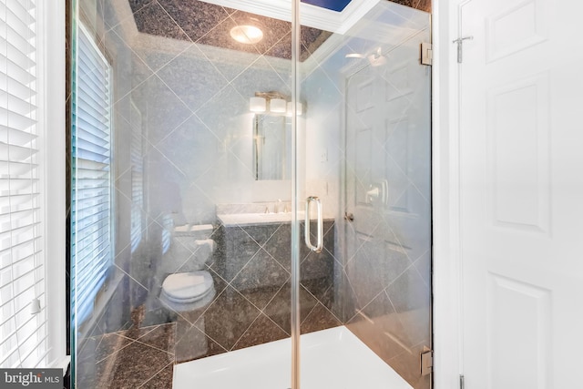 full bath with granite finish floor, a stall shower, and toilet