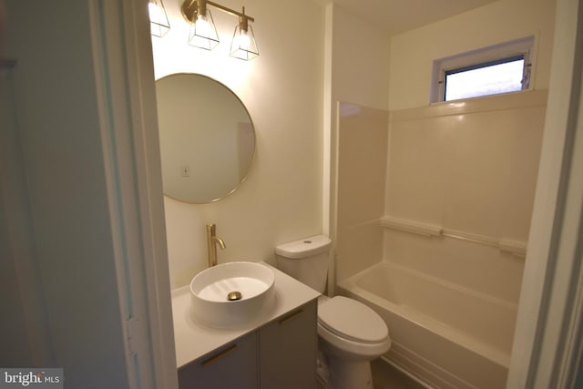 bathroom with vanity, toilet, and tub / shower combination