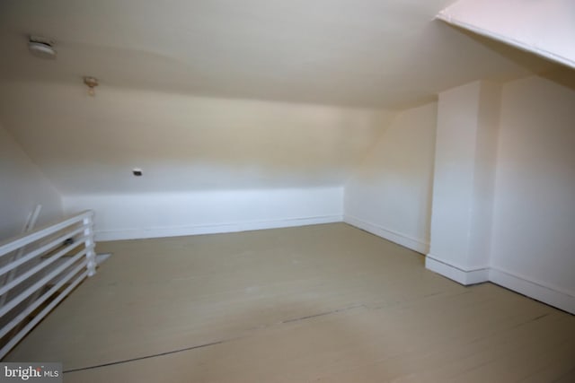 additional living space featuring lofted ceiling