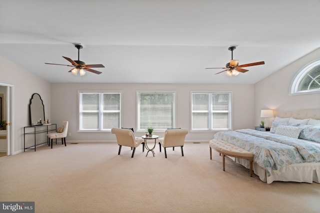 carpeted bedroom featuring baseboards, lofted ceiling, and ceiling fan