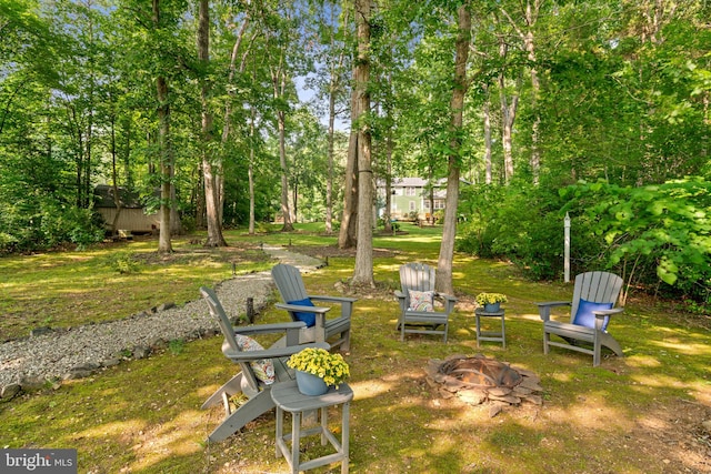 view of yard with a fire pit