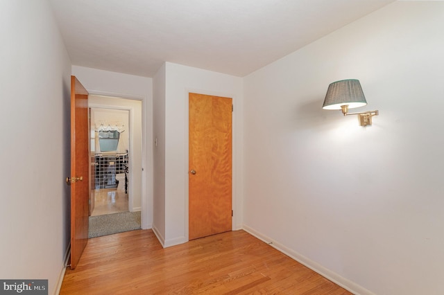 unfurnished bedroom with light wood-style floors and baseboards