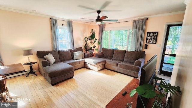 living room with crown molding, a ceiling fan, and a wealth of natural light