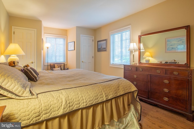 bedroom featuring wood finished floors