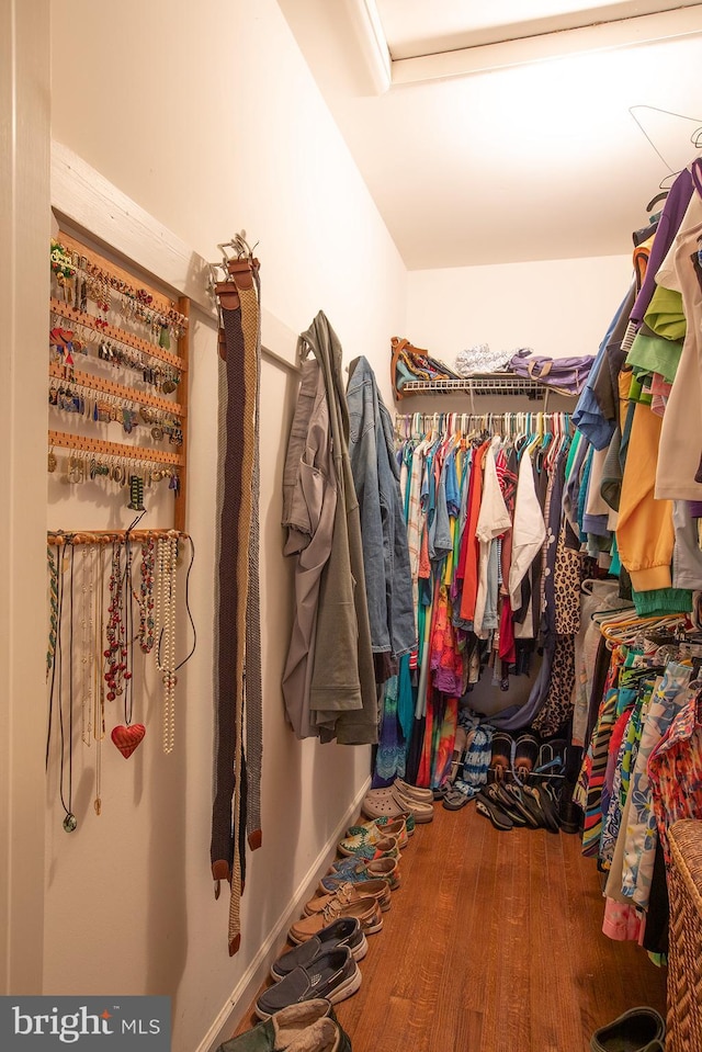 spacious closet with wood finished floors
