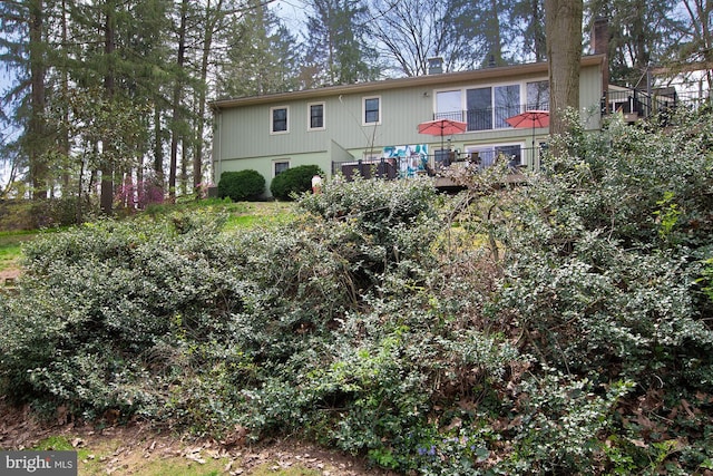 rear view of house with a chimney