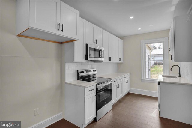 226 W Franklin St, Womelsdorf, PA 19567 - kitchen with baseboards, tasteful backsplash, appliances with stainless steel finishes, and light countertops