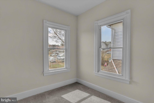 226 W Franklin St, Womelsdorf, PA 19567 - carpeted empty room featuring a wealth of natural light and baseboards