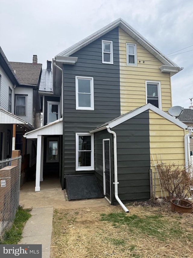 226 W Franklin St, Womelsdorf, PA 19567 - rear view of house with a patio and fence