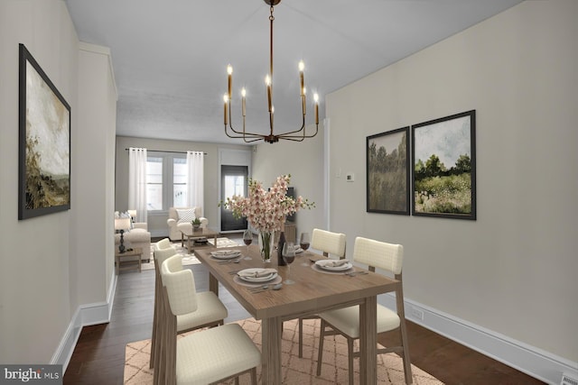 226 W Franklin St, Womelsdorf, PA 19567 - dining area featuring a notable chandelier, wood finished floors, and baseboards