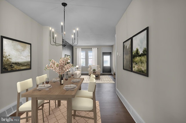 226 W Franklin St, Womelsdorf, PA 19567 - dining space with a chandelier, visible vents, dark wood finished floors, and baseboards
