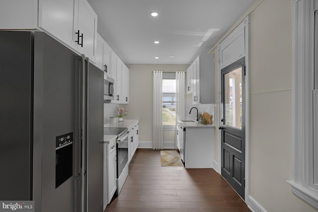 226 W Franklin St, Womelsdorf, PA 19567 - kitchen featuring white cabinetry, stainless steel appliances, light countertops, dark wood-style flooring, and recessed lighting