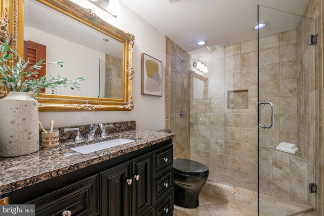 bathroom featuring a shower stall, toilet, recessed lighting, tile patterned floors, and vanity
