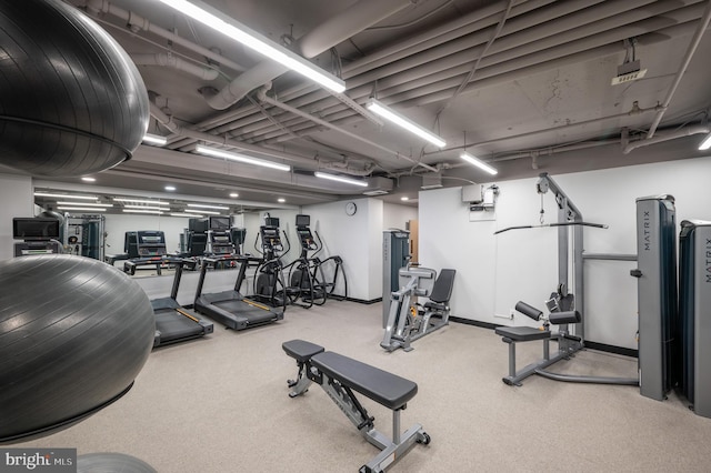 exercise room with baseboards