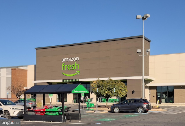 view of property featuring uncovered parking