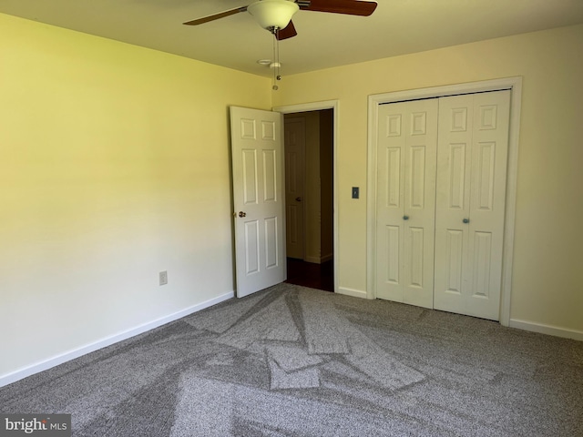 unfurnished bedroom with carpet floors, a ceiling fan, baseboards, and a closet