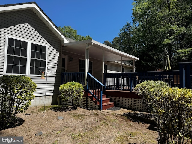 doorway to property featuring a deck