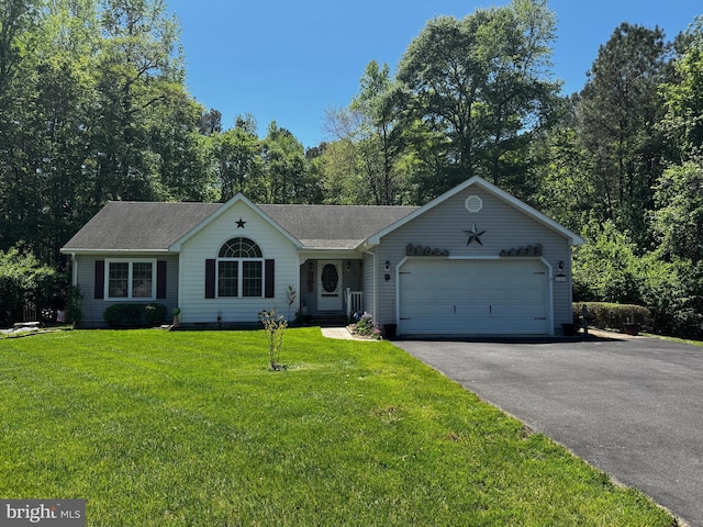 ranch-style home with roof with shingles, driveway, a front yard, and a garage