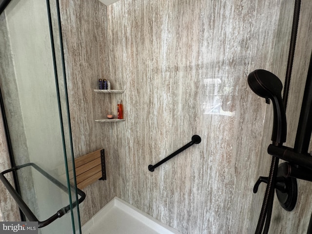 interior space with tiled shower