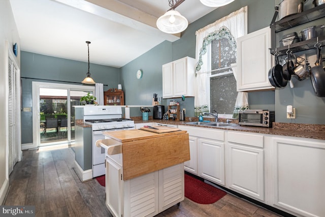kitchen with white cabinets, a sink, white gas range, vaulted ceiling with beams, and dark wood-type flooring