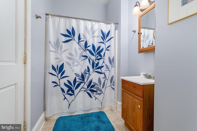 full bath featuring a shower with curtain, tile patterned floors, and vanity