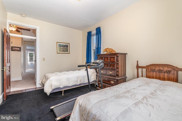 bedroom with carpet floors and baseboards