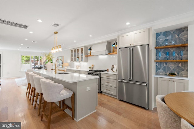 1708 10th St NW, Washington, DC 20001 - kitchen with a sink, high end appliances, premium range hood, and visible vents