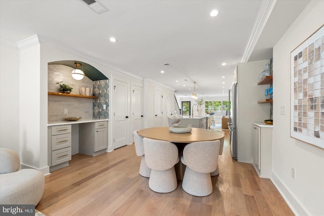 1708 10th St NW, Washington, DC 20001 - dining area with recessed lighting, ornamental molding, and light wood-style flooring