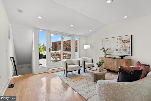 1708 10th St NW, Washington, DC 20001 - living room with recessed lighting, visible vents, wood finished floors, and lofted ceiling