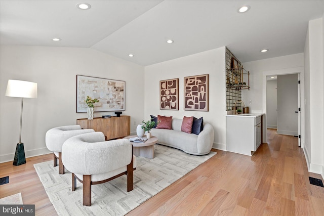 1708 10th St NW, Washington, DC 20001 - living area featuring visible vents, baseboards, light wood finished floors, lofted ceiling, and recessed lighting