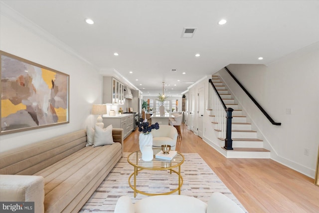 1708 10th St NW, Washington, DC 20001 - living room with light wood-style floors, recessed lighting, visible vents, ornamental molding, and stairway