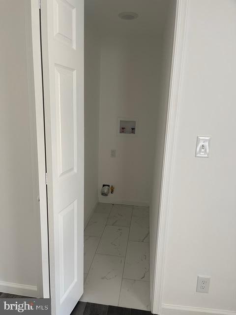 laundry room featuring washer hookup, laundry area, marble finish floor, and baseboards