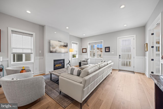 13 N Vendome Ave, Margate City, NJ 08402 - living area featuring a fireplace, wainscoting, light wood-style flooring, recessed lighting, and a decorative wall