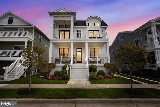 13 N Vendome Ave, Margate City, NJ 08402 - view of front of house featuring a balcony, stairway, covered porch, and a lawn