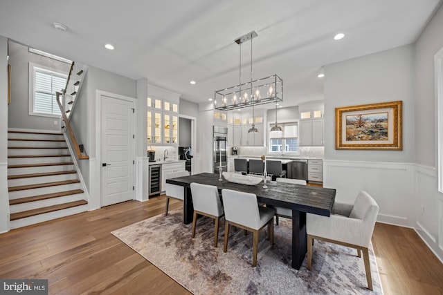 13 N Vendome Ave, Margate City, NJ 08402 - dining space with beverage cooler, stairs, wood finished floors, healthy amount of natural light, and recessed lighting