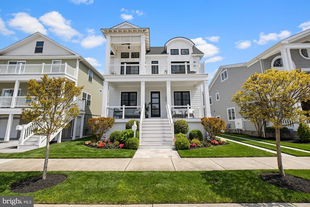 13 N Vendome Ave, Margate City, NJ 08402 - view of front of property with stairs, a balcony, a porch, and a front yard