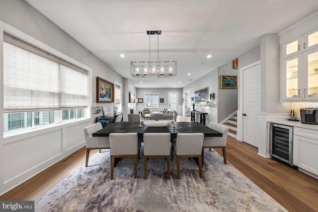 13 N Vendome Ave, Margate City, NJ 08402 - dining space with wine cooler, bar area, dark wood finished floors, recessed lighting, and a chandelier