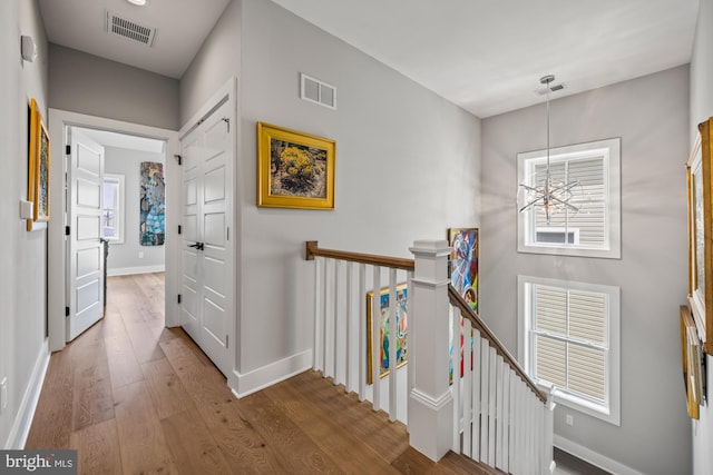 13 N Vendome Ave, Margate City, NJ 08402 - hallway with an upstairs landing, wood finished floors, and baseboards