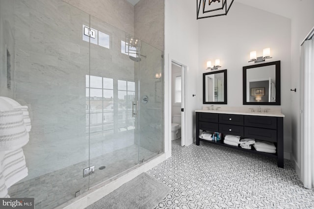 13 N Vendome Ave, Margate City, NJ 08402 - full bathroom with toilet, a stall shower, double vanity, baseboards, and a towering ceiling