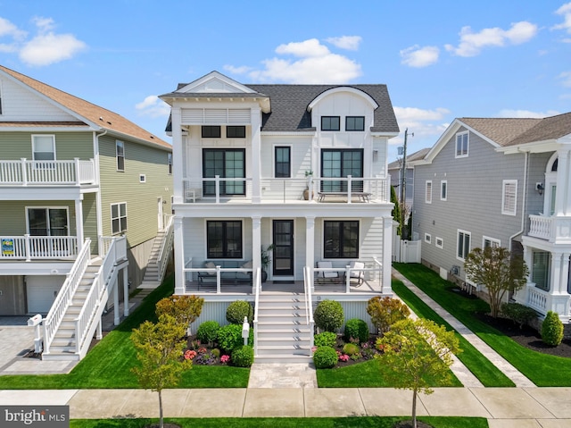 13 N Vendome Ave, Margate City, NJ 08402 - view of front of home with stairs, a balcony, covered porch, and roof with shingles