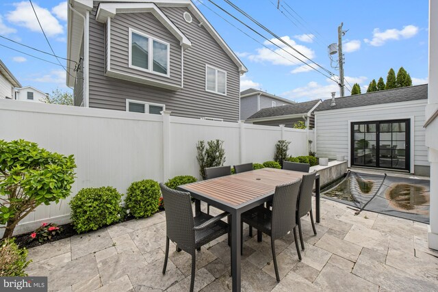 13 N Vendome Ave, Margate City, NJ 08402 - view of patio featuring a fenced backyard and outdoor dining area