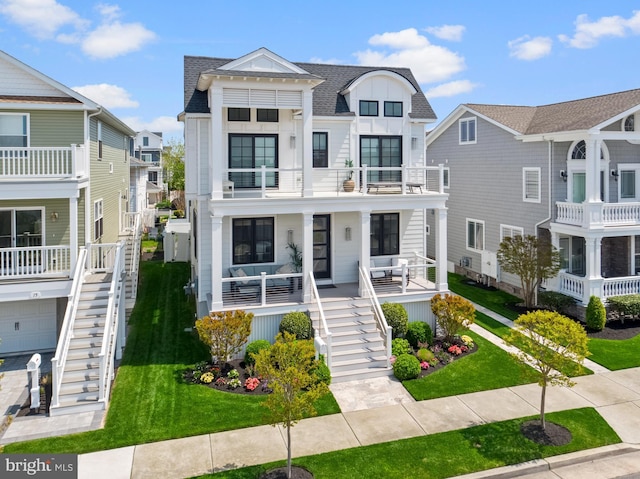 13 N Vendome Ave, Margate City, NJ 08402 - view of front of home with stairs, a balcony, a shingled roof, a porch, and a front yard
