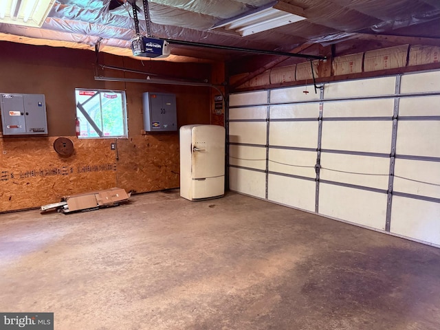 garage featuring a garage door opener and electric panel
