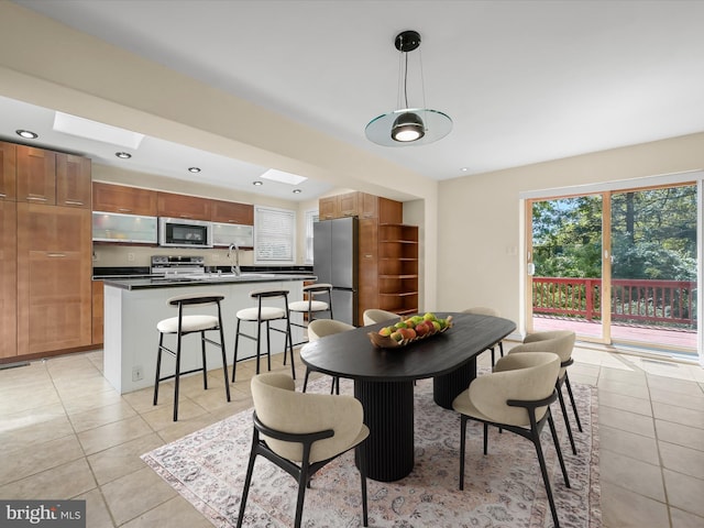 dining area featuring recessed lighting and light tile patterned floors