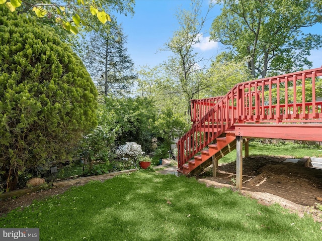 view of yard featuring stairway and a deck