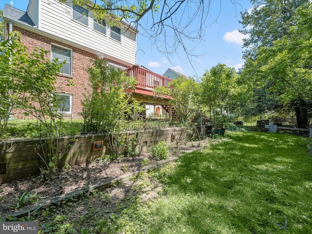 view of yard with a wooden deck