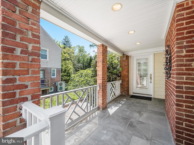 exterior space featuring ac unit and covered porch