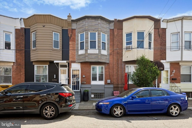 townhome / multi-family property with brick siding