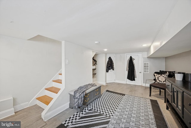 mudroom featuring baseboards, recessed lighting, and wood finished floors