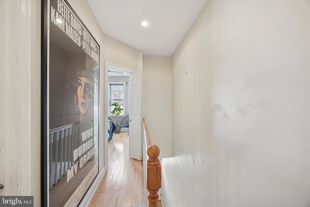 hallway with recessed lighting and hardwood / wood-style flooring